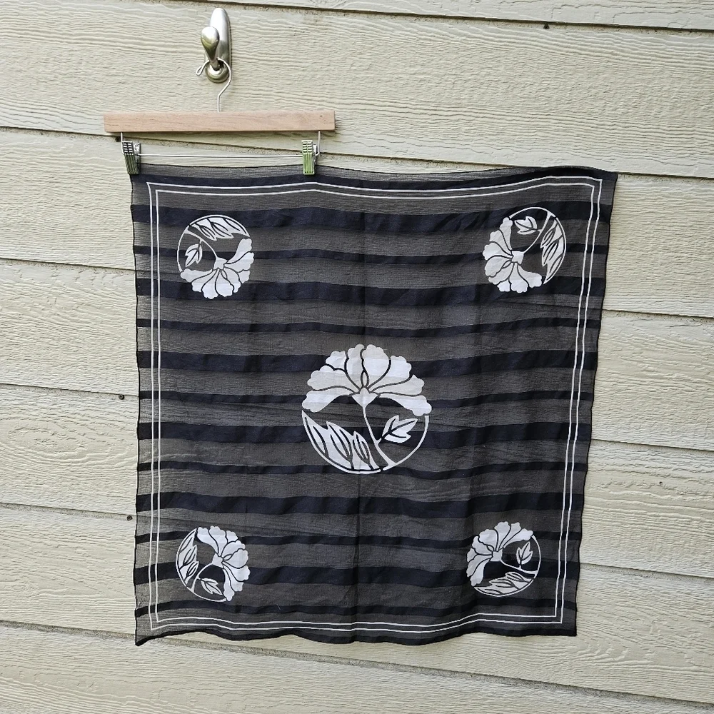 square black scarf with sheer stripes and white flowers